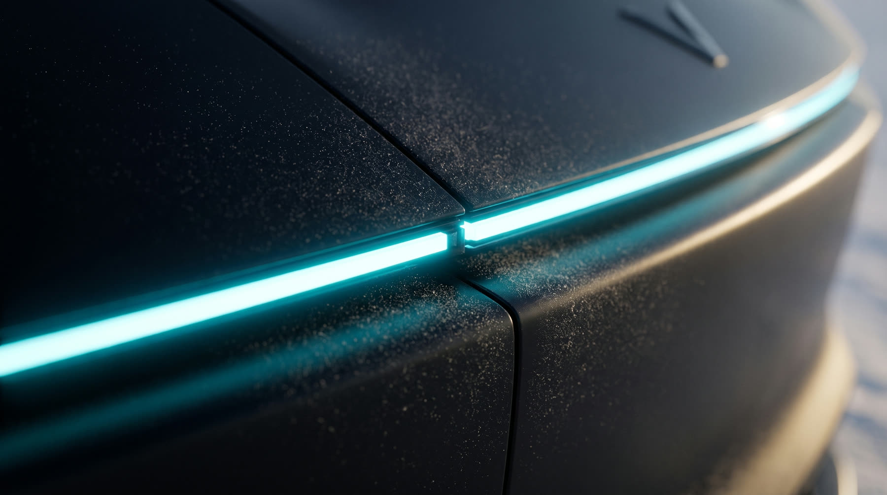 Macro detail of the VASAV light bar meeting the matte obsidian bodywork