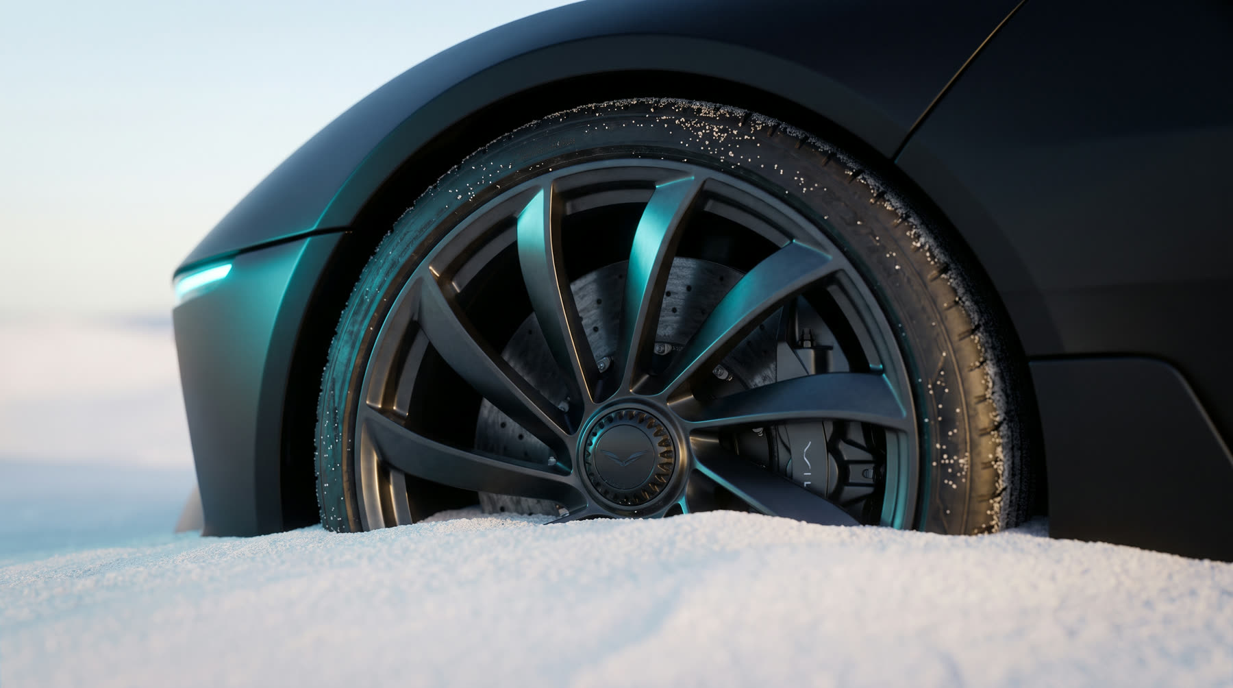 Macro detail of a VASAV forged turbine wheel half-sunk in white sand